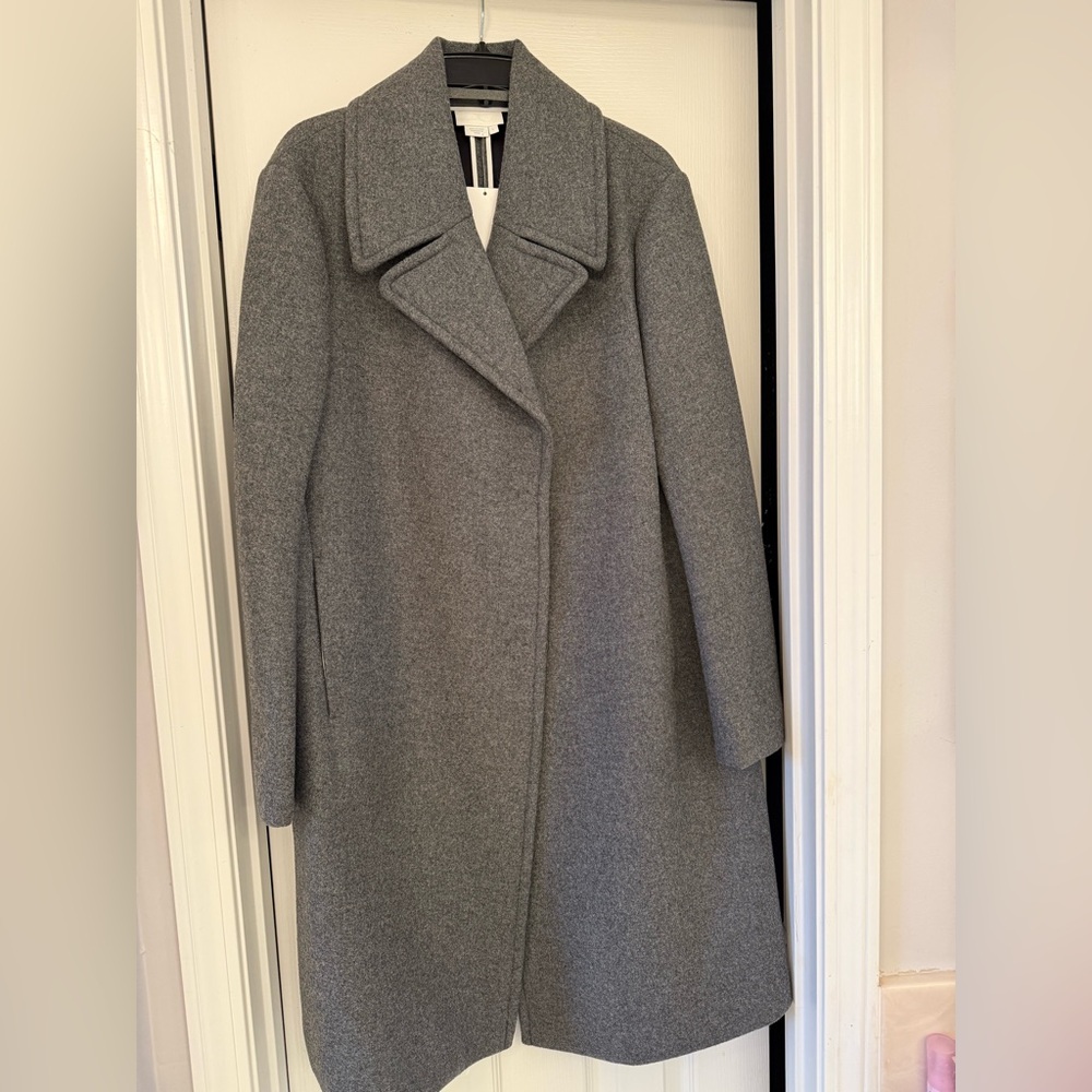 Gorgeous DKNY coat size large. 
Never been worn.